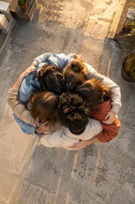 Overhead Friends Group Hug at Golden Hour