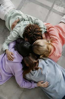 Diverse Friends Sharing Quiet Circle Hug