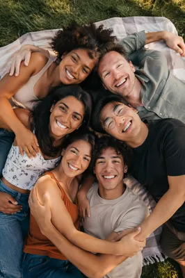 Six Friends Hugging on Picnic Blanket