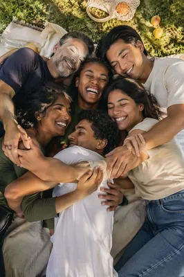 Six Friends Hugging on Picnic Blanket