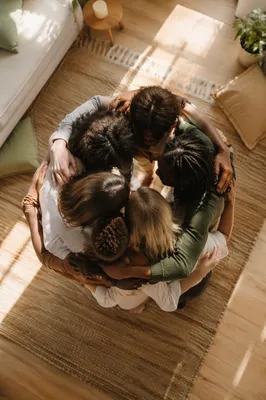Overhead Friends Hug Circle in Sunlit Room