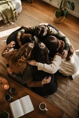 Friends Group Hug After Faith Gathering