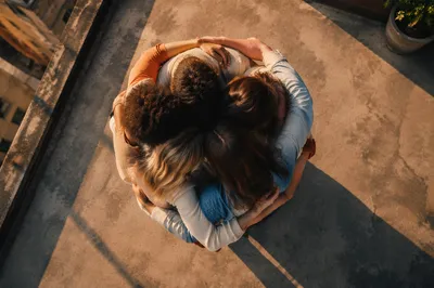 Overhead Friends Group Hug at Golden Hour