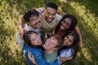 Six Friends Hugging in Park Circle