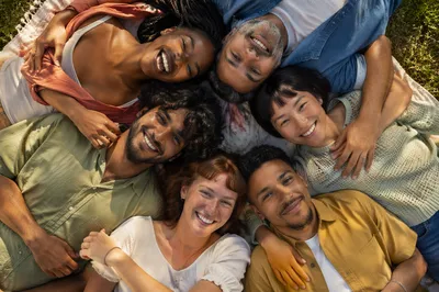 Six Friends Hug Circle in Park