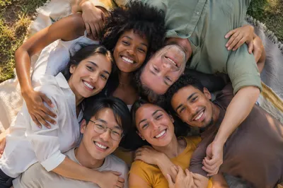 Six Friends Hugging on Picnic Blanket