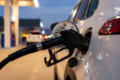 Evening Car Fueling at Gas Station