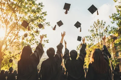 Graduation Caps Tossed at Sunset Celebration