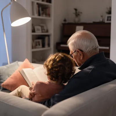 Grandfather and Grandchild Reading Bible Together