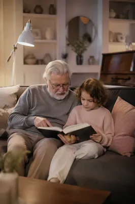 Grandfather and Grandchild Reading Bible Together