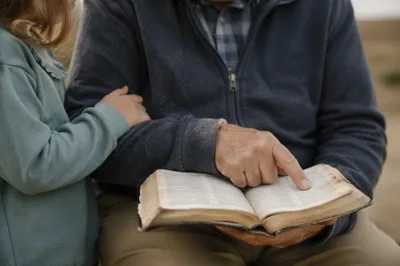 Grandfather and Grandchild Reading the Bible
