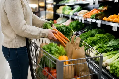 Fresh Produce Shopping Cart in Grocery Aisle