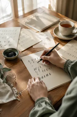 Sunlit Hand Lettering Practice at Wooden Table