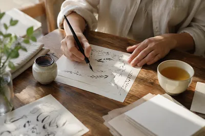 Sunlit Calligraphy Practice With Ink Pen