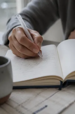 Hand Writing in a Quiet Prayer Journal