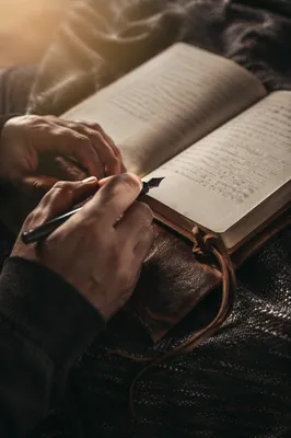 Hand Writing in a Quiet Prayer Journal