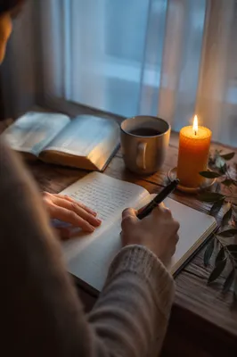 Hands Writing in a Dawn Prayer Journal