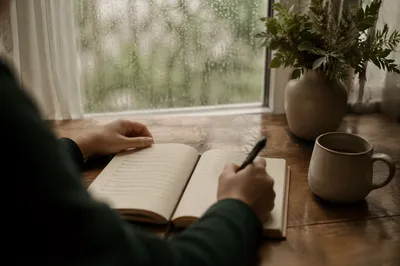 Hands Writing in Prayer Journal Morning