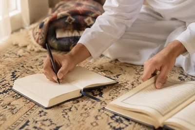Hand Writing in a Prayer Journal
