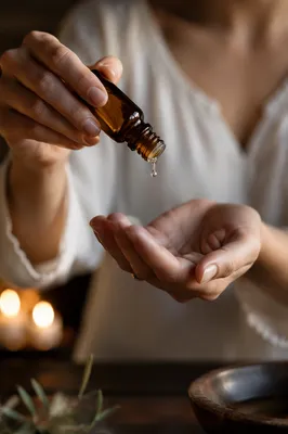Hands Anointing With Oil in Prayer