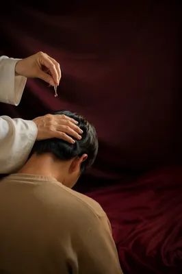 Hands Anointing With Oil in Prayer