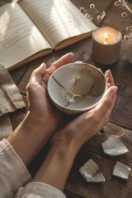 Kintsugi Bowl Held in Gentle Hands