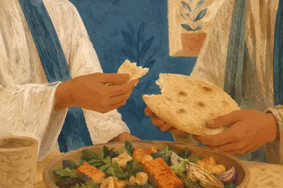 Hands Sharing Warm Flatbread at Table