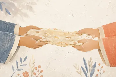 Hands Sharing Rustic Bread in Warm Light