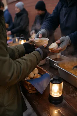 Compassionate Hands Serving Soup and Bread