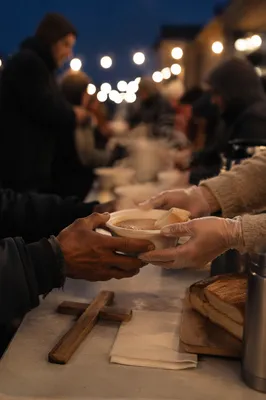 Volunteers Serving Soup With Compassion at Dusk