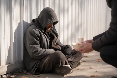 Compassionate Meal Offered to Unhoused Adult