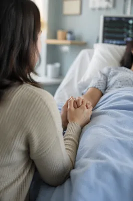 Hospital Bedside Prayer Holding Patient Hand