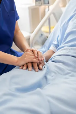 Hospital Bedside Prayer and Comforting Hands