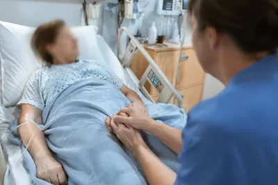 Hospital Bedside Prayer With Patient Hand