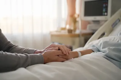 Hospital Bedside Prayer and Comforting Hands