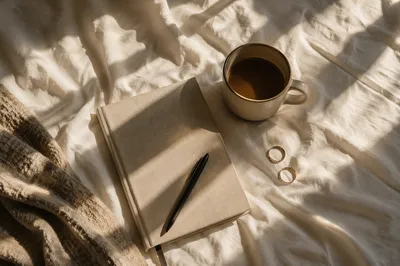 Morning Coffee and Notebook on Bedding