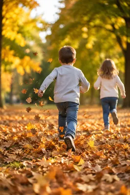 Children Running Through Autumn Park Leaves