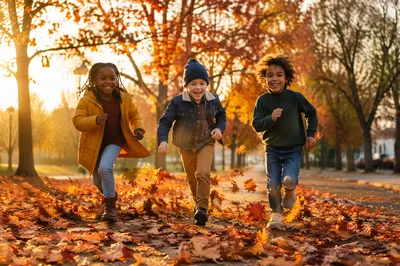Children Running Through Autumn Park Path