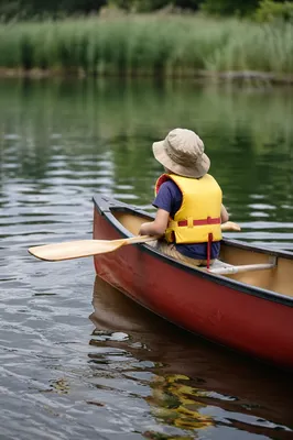 Child Canoeing on Peaceful Summer Lake