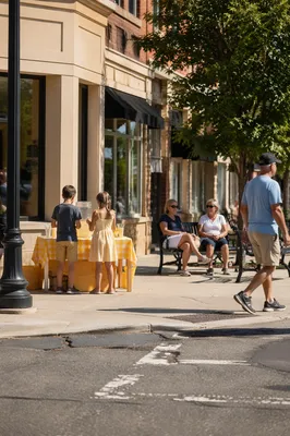 Children Running Lemonade Stand on Summer Sidewalk