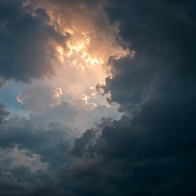 Hopeful Sunlight Breaking Through Storm Clouds