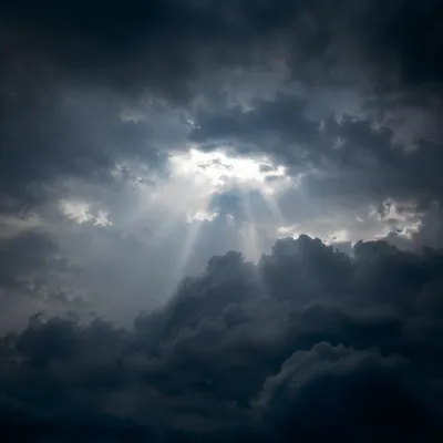 Hopeful Light Breaking Through Storm Clouds