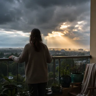 Hopeful Sunlight Through Storm Clouds Balcony Scene