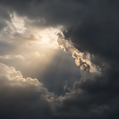 Hopeful Sunlight Through Storm Clouds