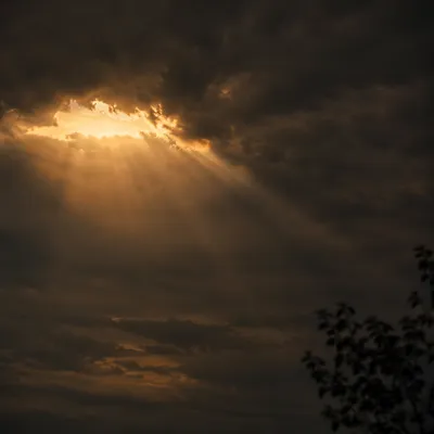 Golden Light Breaking Through Storm Clouds