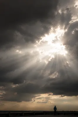 Sunlight Breaking Through Storm Clouds of Hope