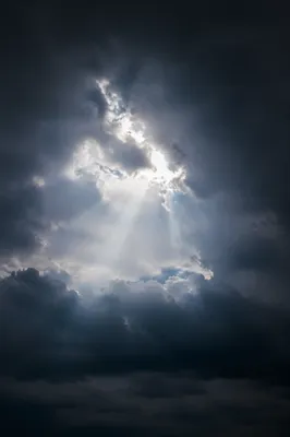 Hopeful Light Through Dark Storm Clouds