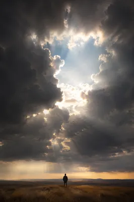 Hopeful Sunlight Through Dark Storm Clouds