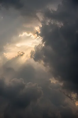 Hopeful Sunlight Breaking Through Storm Clouds