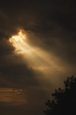 Golden Light Breaking Through Storm Clouds